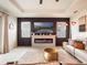 Contemporary living room with a decorative fireplace, wall art, and ample seating at 4743 Nw 11Th Ct, Ocala, FL 34475