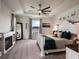 Spacious main bedroom featuring a tray ceiling, ceiling fan and fireplace at 4743 Nw 11Th Ct, Ocala, FL 34475