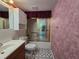 Full bathroom with glass enclosed shower, single sink vanity, and patterned linoleum flooring at 606 Midway Dr # B, Ocala, FL 34472