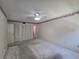 Bedroom with neutral carpet, ceiling fan, wallpaper border, and mirrored closet doors at 606 Midway Dr # B, Ocala, FL 34472
