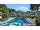 Outdoor community pool with lounge chairs, tables, and landscaped surroundings at 606 Midway Dr # B, Ocala, FL 34472