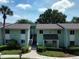 Inviting two-story condo building featuring well-maintained landscaping and convenient parking at 606 Midway Dr # B, Ocala, FL 34472