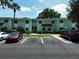 Inviting two-story condo building featuring well-maintained landscaping and convenient parking at 606 Midway Dr # B, Ocala, FL 34472