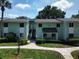 Inviting two-story condo building featuring well-maintained landscaping and convenient parking at 606 Midway Dr # B, Ocala, FL 34472