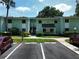 Inviting two-story condo building featuring well-maintained landscaping and convenient parking at 606 Midway Dr # B, Ocala, FL 34472