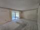Spacious living room featuring carpet and a large window with sheer curtains at 606 Midway Dr # B, Ocala, FL 34472