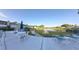 Community pool with lounge chairs and lake view at 606 Midway Dr # B, Ocala, FL 34472