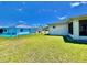 Fenced in backyard with view of adjacent pool at 6070 Sw 98Th Loop, Ocala, FL 34476
