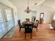 Dining area with hardwood floors and a view to the living area at 6070 Sw 98Th Loop, Ocala, FL 34476