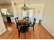 Cozy dining area with hardwood floors and a chandelier at 6070 Sw 98Th Loop, Ocala, FL 34476