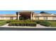 Exterior view of community center surrounded by manicured shrubs and decorative trees at 6070 Sw 98Th Loop, Ocala, FL 34476