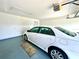 Spacious garage features ample lighting, room for parking, and convenient storage solutions at 6070 Sw 98Th Loop, Ocala, FL 34476