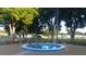 A community hot tub provides a relaxing space amid lush landscaping and recreational amenities at 6070 Sw 98Th Loop, Ocala, FL 34476
