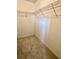 Walk-in closet with wire shelving, perfect for organized storage at 6070 Sw 98Th Loop, Ocala, FL 34476