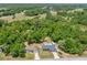 Aerial view showcasing homes with well-maintained lawns, mature trees, and the neighborhood layout at 6306 Pecan Crse, Ocala, FL 34472