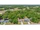 The home features a well-maintained yard and mature trees and provides neighborhood views at 6306 Pecan Crse, Ocala, FL 34472