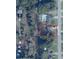 Aerial view of a property with a lush green yard and mature trees along Pecan Crse at 6306 Pecan Crse, Ocala, FL 34472
