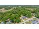 Bird's eye view featuring houses with mature trees, well-kept lawns, and neighborhood streets at 6306 Pecan Crse, Ocala, FL 34472