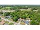 Scenic aerial view of home and community with lush green landscape and convenient highway access at 6306 Pecan Crse, Ocala, FL 34472