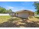 The home's spacious backyard features a patio area perfect for outdoor relaxation and dining at 6306 Pecan Crse, Ocala, FL 34472