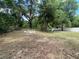 Large backyard with ample space, including a fire pit area and fenced perimeter at 6306 Pecan Crse, Ocala, FL 34472