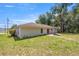 The home's backyard features a patio and expansive green space for outdoor enjoyment at 6306 Pecan Crse, Ocala, FL 34472