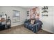 Cozy bedroom space with couch and window at 6306 Pecan Crse, Ocala, FL 34472