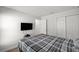 Practical bedroom with a television and double-door closet at 6306 Pecan Crse, Ocala, FL 34472