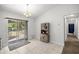 Bright dining area with sliding glass doors and stylish hutch at 6306 Pecan Crse, Ocala, FL 34472