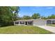 Charming single story home featuring a two car garage, manicured lawn, and classic curb appeal at 6306 Pecan Crse, Ocala, FL 34472