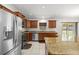 Modern kitchen with stainless steel appliances, granite countertops and a breakfast bar island at 6306 Pecan Crse, Ocala, FL 34472
