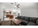 Inviting living room with a comfy sofa, open layout to a kitchen with stainless steel appliances at 6306 Pecan Crse, Ocala, FL 34472