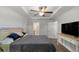 Spacious main bedroom featuring a tray ceiling and ensuite bathroom access at 6306 Pecan Crse, Ocala, FL 34472