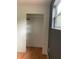 Closet with shelving featuring wood floors and painted walls at 6498 Se 167Th Ct, Ocklawaha, FL 32179