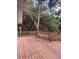 Over-sized deck featuring greenery views, providing a peaceful outdoor space for relaxation and enjoyment at 6498 Se 167Th Ct, Ocklawaha, FL 32179