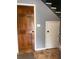 Inviting entryway showcasing a traditional wood door, tile flooring, and staircase access at 6498 Se 167Th Ct, Ocklawaha, FL 32179