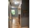 Hallway displaying tile floors, a welcome sign, a staircase, and a storage closet at 6498 Se 167Th Ct, Ocklawaha, FL 32179