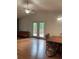Living room with hardwood floors, high ceilings and double glass doors at 6498 Se 167Th Ct, Ocklawaha, FL 32179