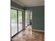 Living room features sliding glass doors and tile floors at 6498 Se 167Th Ct, Ocklawaha, FL 32179