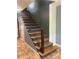 Carpeted staircase featuring painted risers and natural wood treads at 6498 Se 167Th Ct, Ocklawaha, FL 32179