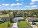 Aerial of a single-story home highlighting the property lines and surrounding neighborhood at 6730 Cherry Rd, Ocala, FL 34472
