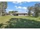 Backyard with a well-maintained lawn at 6730 Cherry Rd, Ocala, FL 34472