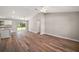 A spacious open-concept living room with vaulted ceiling and wood-look flooring at 6730 Cherry Rd, Ocala, FL 34472