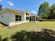 Lovely home showcasing a covered patio and beautiful lawn at 6836 Sw 112Th St, Ocala, FL 34476