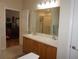 Spacious bathroom with double sinks and a large mirror at 6836 Sw 112Th St, Ocala, FL 34476