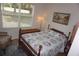 Bedroom with hardwood floors, ceiling fan, bed, and chest of drawers at 6836 Sw 112Th St, Ocala, FL 34476