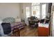 Bright bedroom with wood floors, fan, daybed, and large windows at 6836 Sw 112Th St, Ocala, FL 34476