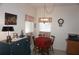 Charming dining area with a round table, red tablecloth, and a decorative chandelier at 6836 Sw 112Th St, Ocala, FL 34476