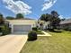 Charming single-story home with a well-maintained lawn and an attached two-car garage at 6836 Sw 112Th St, Ocala, FL 34476