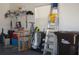 Cluttered Garage with golf clubs, ladder and utility items at 6836 Sw 112Th St, Ocala, FL 34476